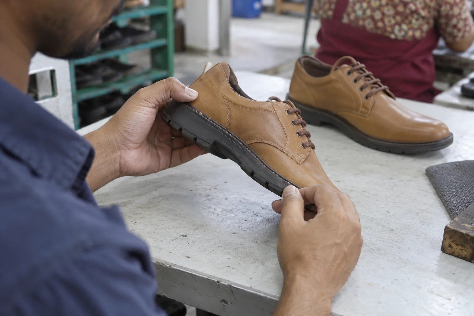 visual check of the upper-to-sole bond line on a leather shoe