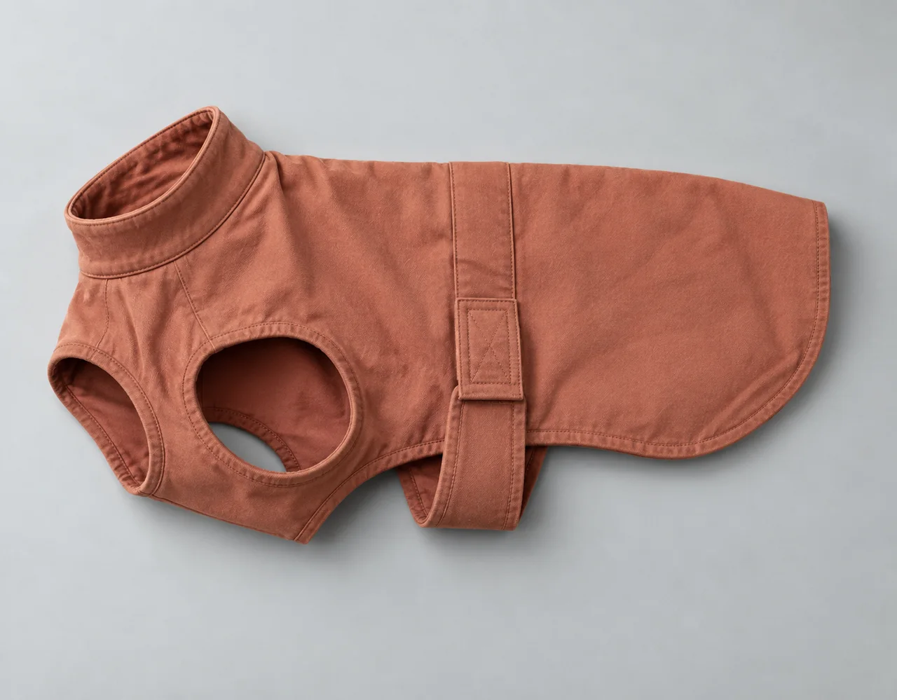 Terracotta cotton dog coat with bound leg openings and adjustable fastening