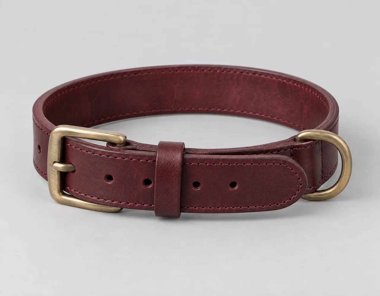 Burgundy leather pet collar with brushed brass buckle and D-ring