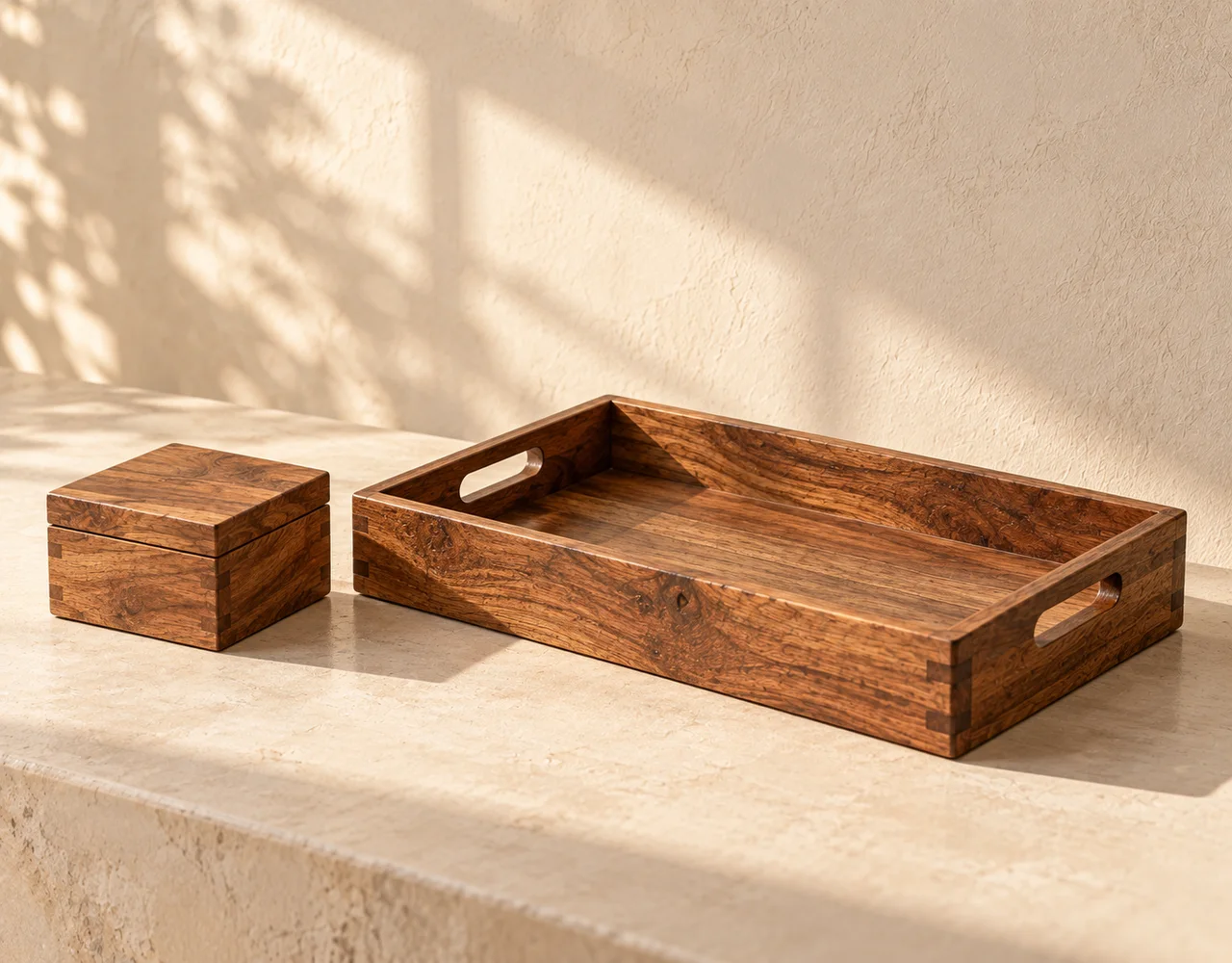 Wooden rectangular tray with handle cut-outs beside a lidded wooden keepsake box